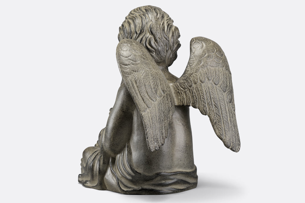back view of cherub garden statue, wings of cherub 