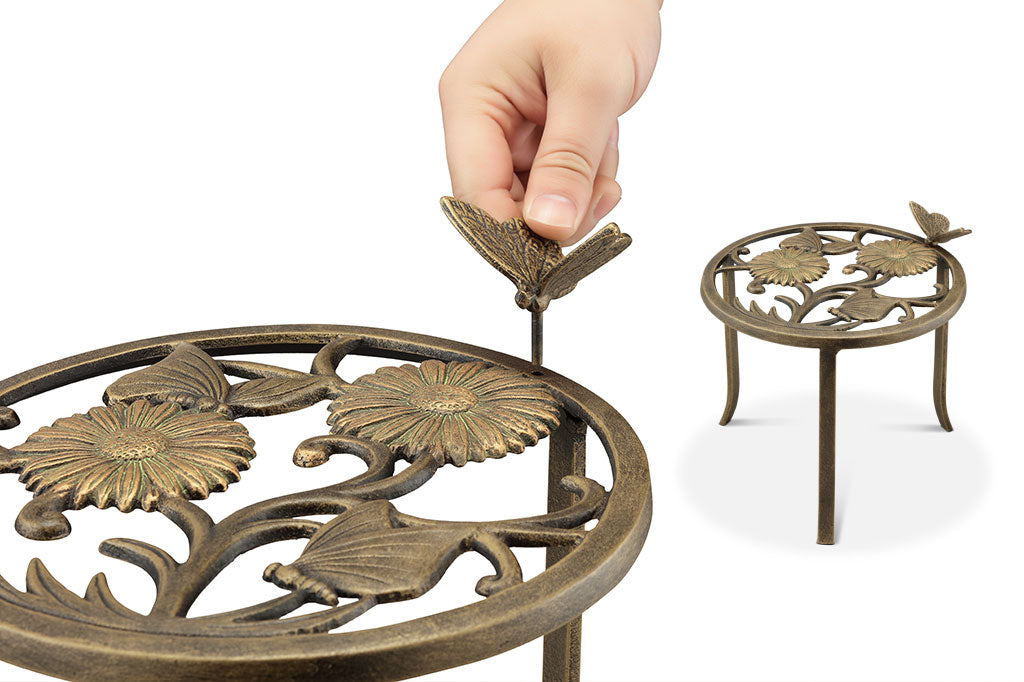 Detail view of the removable butterfly pin on plant stand rim.