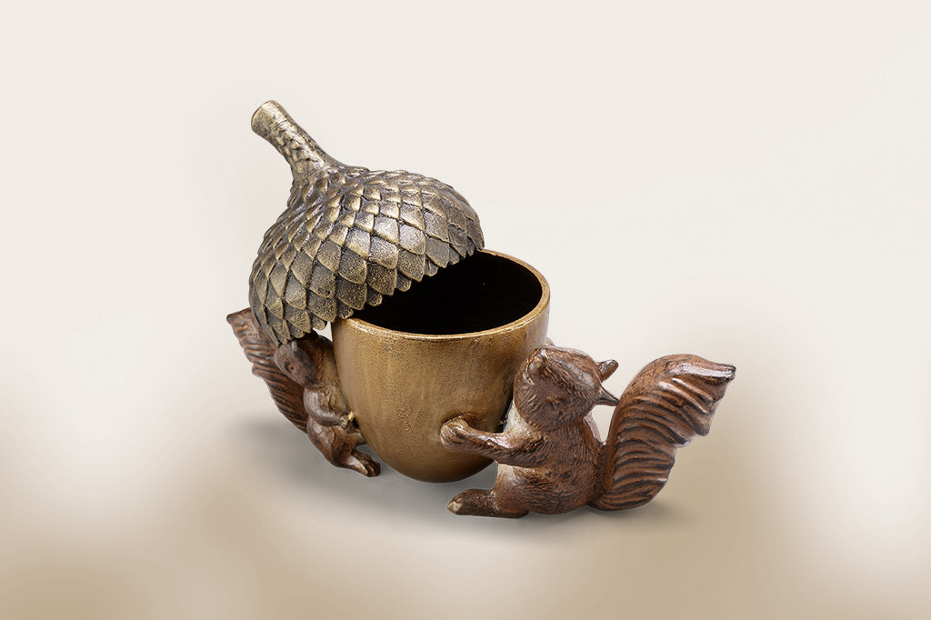 cast metal squirrels holding a acorn treasure box, lid askew