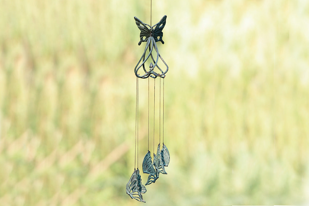 cast metal butterfly and swirl wind art