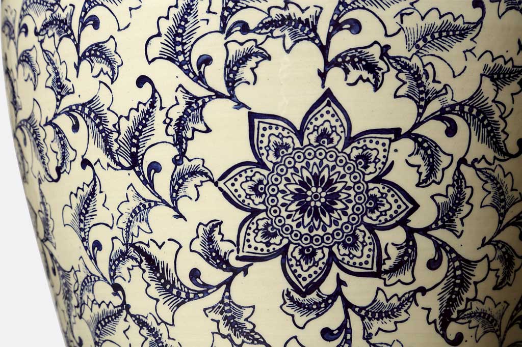 view of ceramic glazed pattern of blue floral print on white