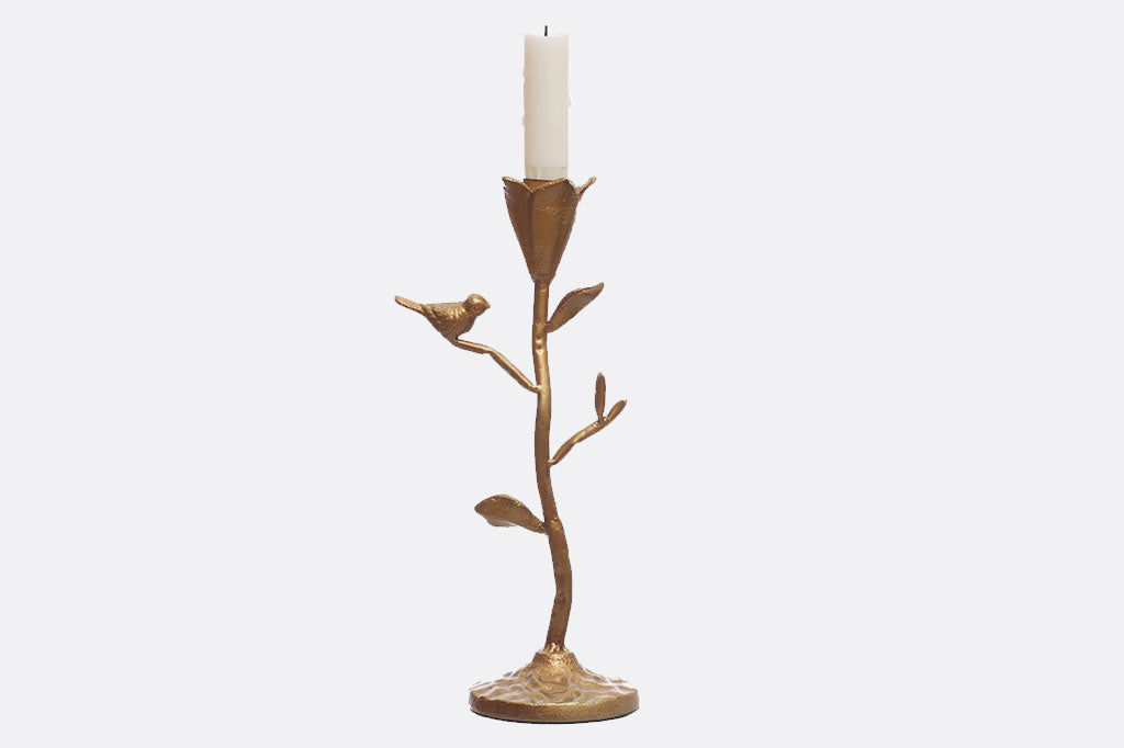 taper candelabra featuring floral cup to hold the candle and perched bird in a golden bronze finish