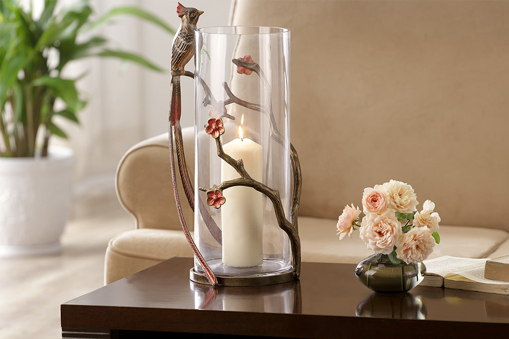 large glass vase with branches and blossoms featuring a cheery flycatcher bird on side of vase