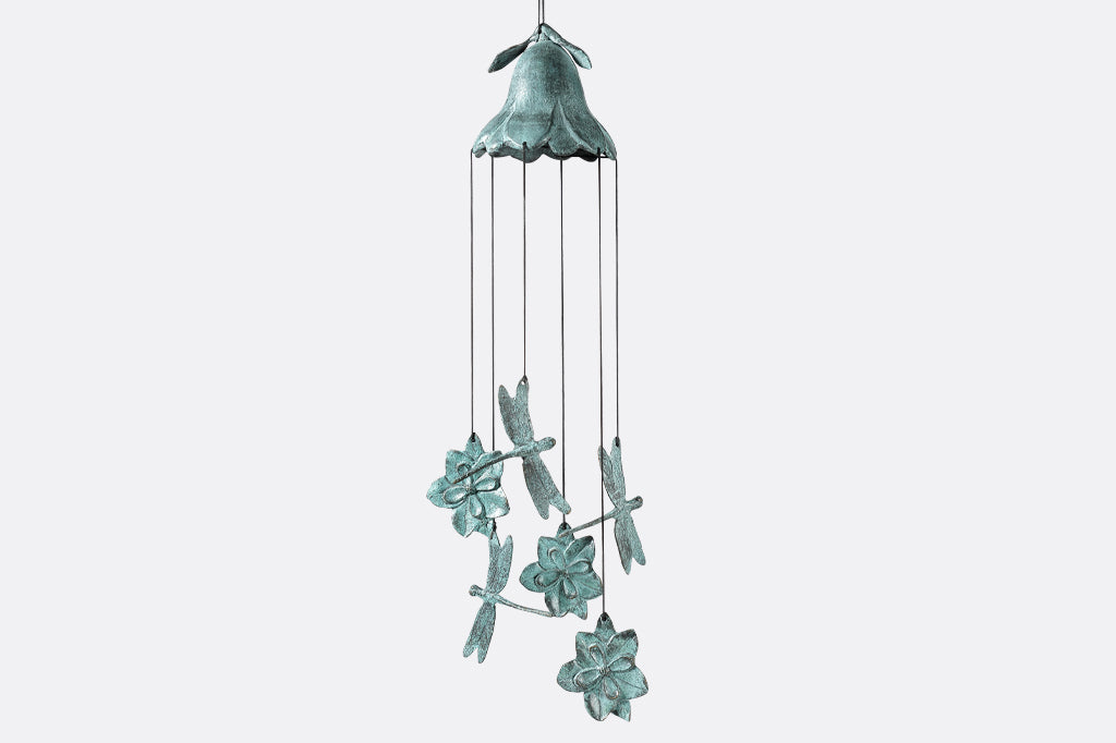 brass wind art showing inverted blossom dome with chime-pendants shaped like blossoms and dragonflies