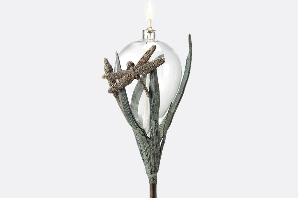 dragonfly and frond sculpted motif on glass oil torch