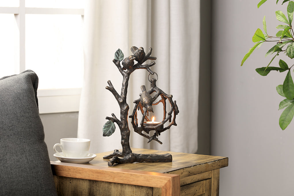 hanging tea light holder, sculpture of birds on a branch with interlocking twigs to form a tealight cage