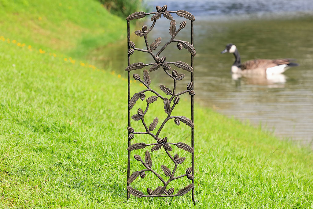 Trailing Pines Trellis on a grassy embankment by a river with a goose