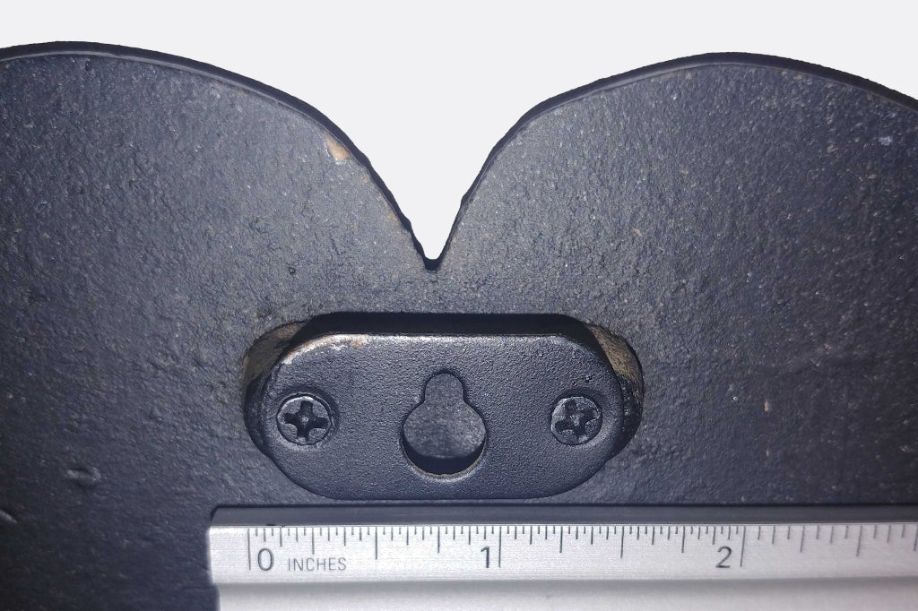 Detailed image of the mounting hardware. Takes on screw to hang wall tile