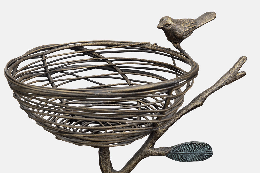 staked garden art that can hold items; shaped like a nest on a branch with decorative bird on rim