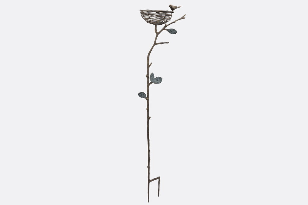 staked garden art that can hold items; shaped like a nest on a branch with decorative bird on rim