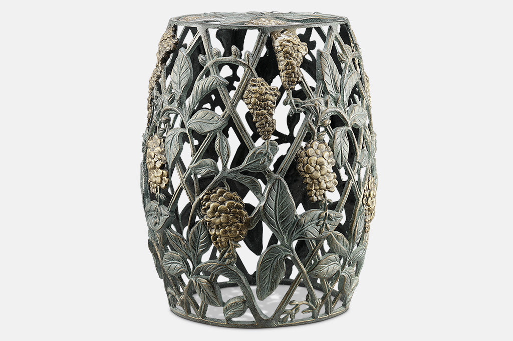 Cast metal garden stool of lattice design and vining blossoms