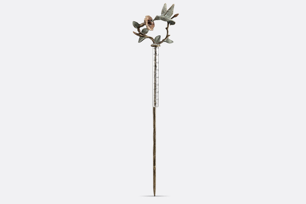 cast metal hummingbird and flower rain catcher