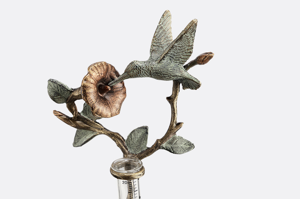 cast metal hummingbird and flower rain catcher