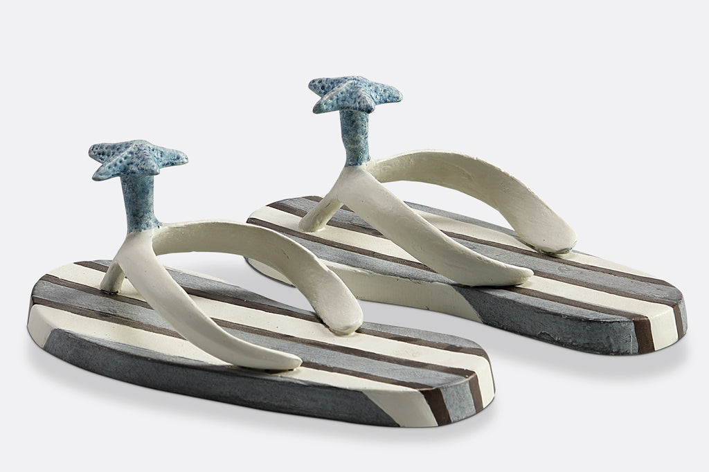 side view of Wall hooks shaped like pair of blue and white striped flip flops with sea shell motif #color_stripe