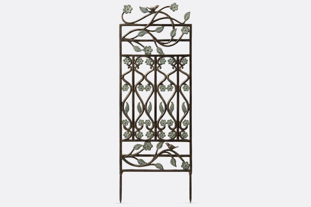 Brindille Trellis features verdi accents, twining branches, and two bird accents.