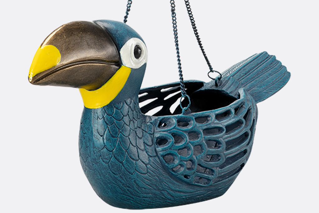Cast metal toucan hanging planter, blue toucan with gold and yellow beak.