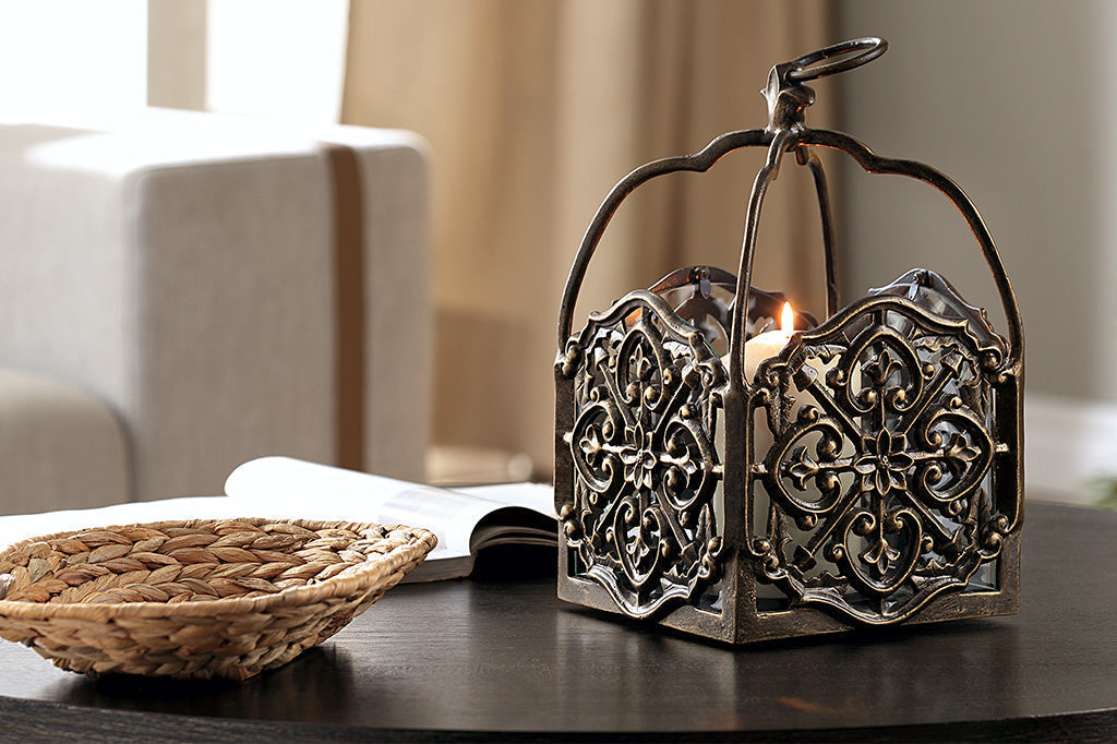 italianate fretwork hanging lantern box with 1 pillar candle shown on coffee table