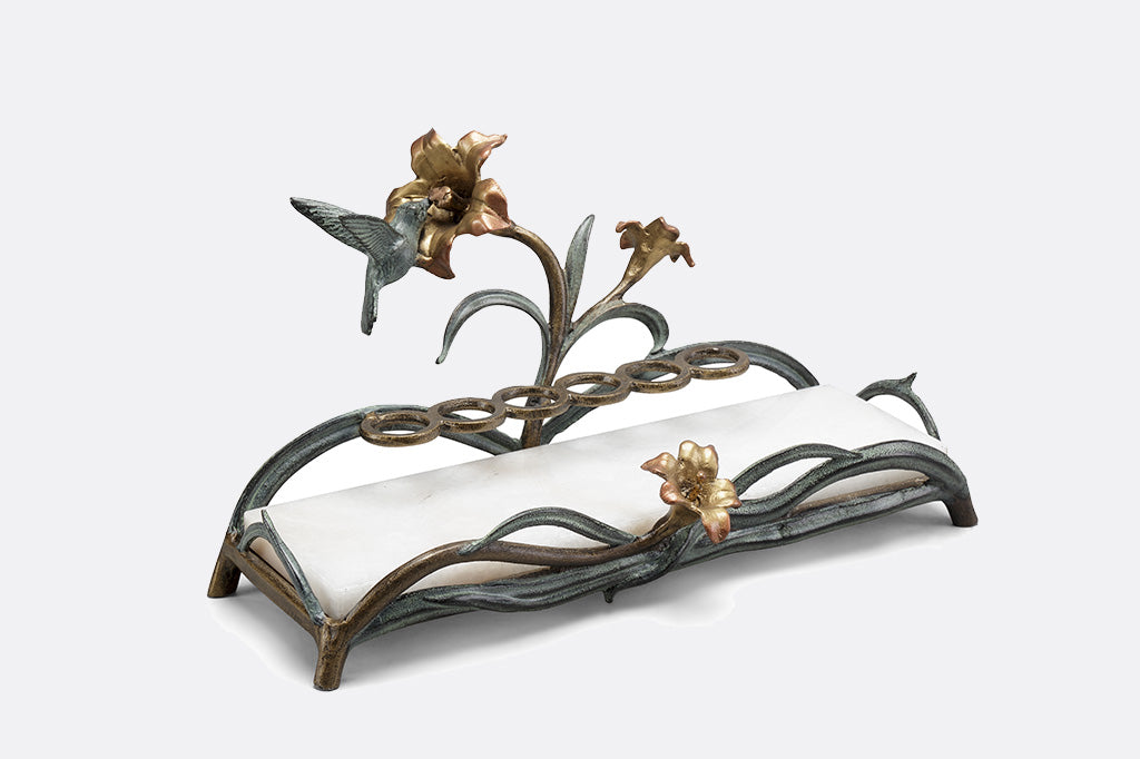 humming bird vanity tray featuring lipstick rings and a with white marble base
