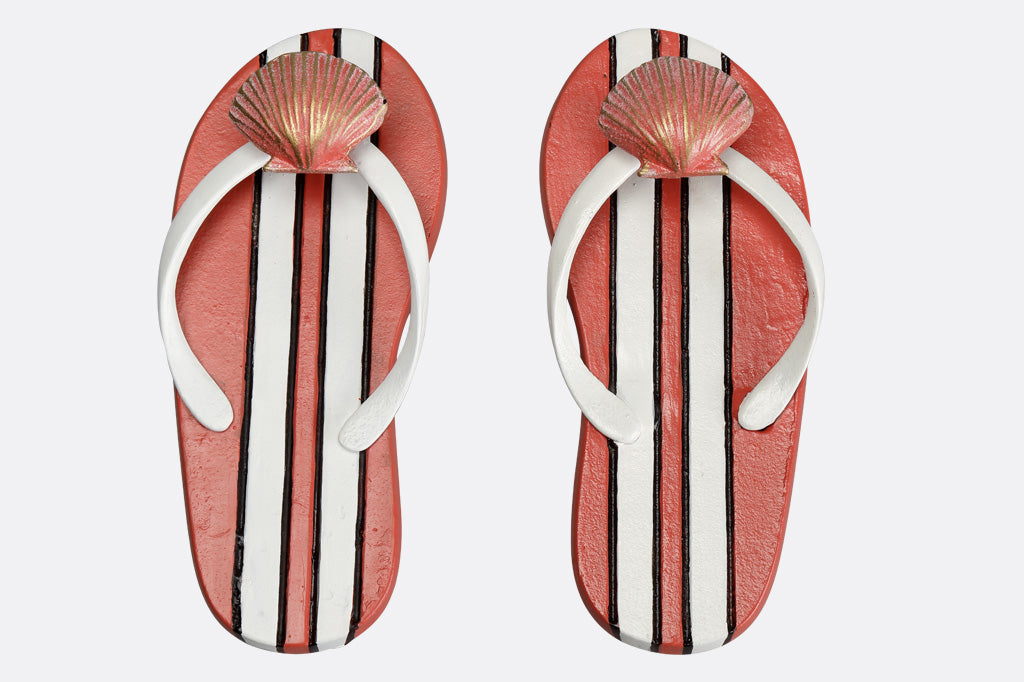 closeup of a pair of wall hooks shaped like flip flops #color_melon