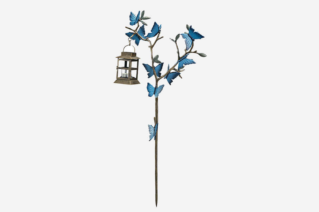 Staked Garden Lantern with design of branch covered with blue butterflies and holds iron little lantern holding tea light