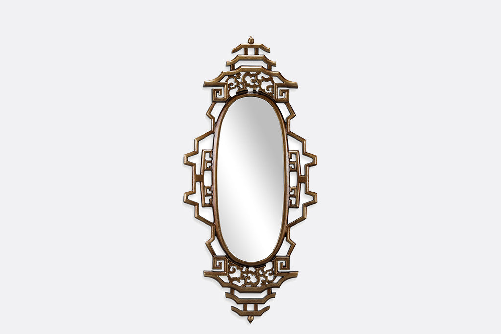 gold wall mirror with asian details on gray background