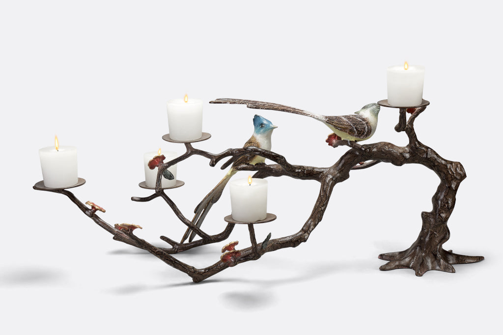 metal candelabra with branch and blossoms featuring two playful birds, holds up to 5 votive candles  
