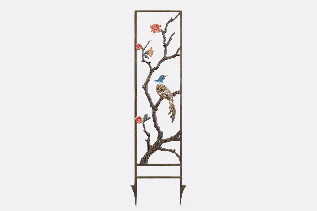 blossom and branch garden trellis featuring a blue and tan bird peering over its right shoulder. 