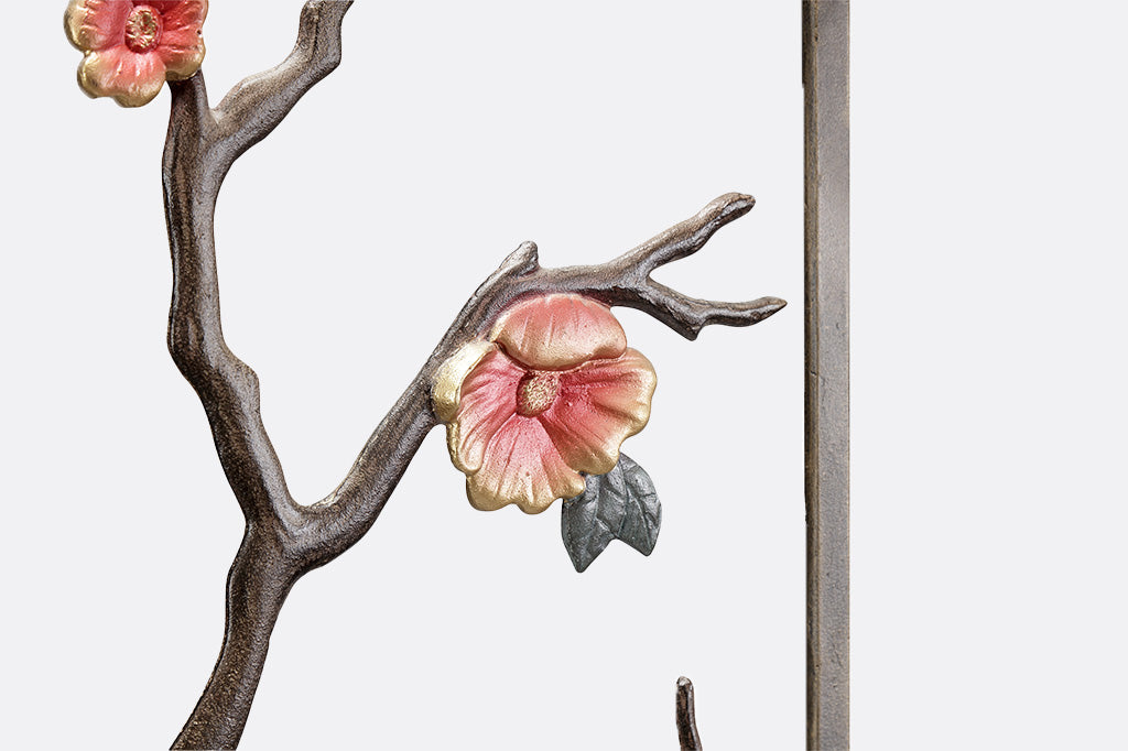 detailed shot of blossom and branch on trellis