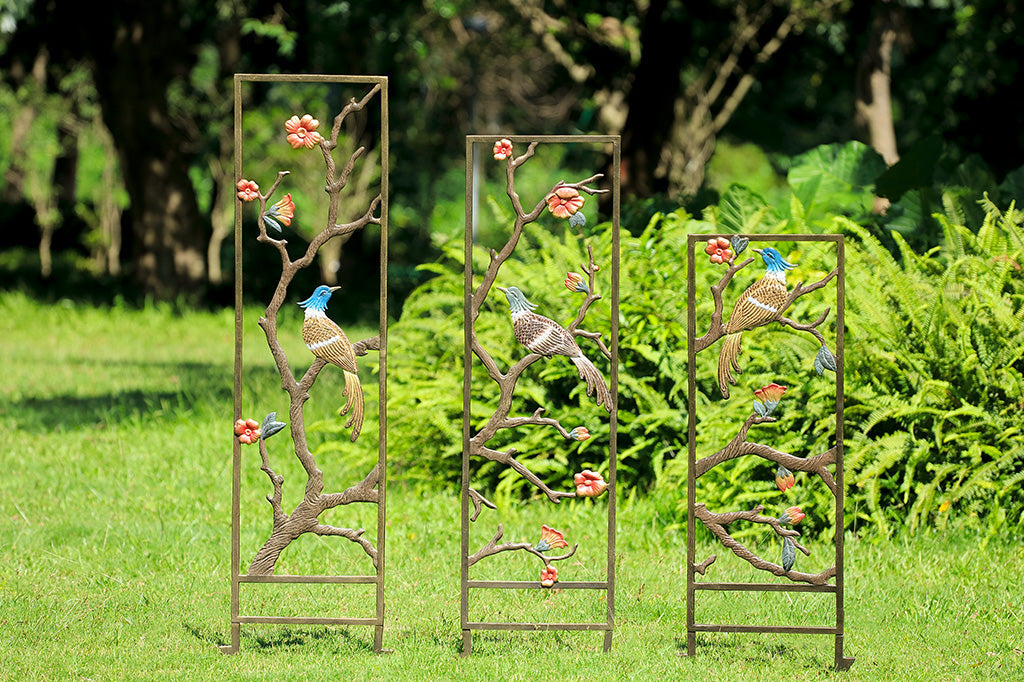 set of three asian tapestry trellises in garden scape 