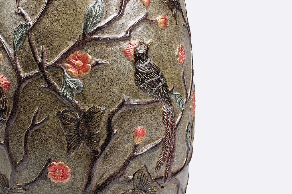 closeup of Flycatcher bird on the Chinoiserie style garden stool with removable lid