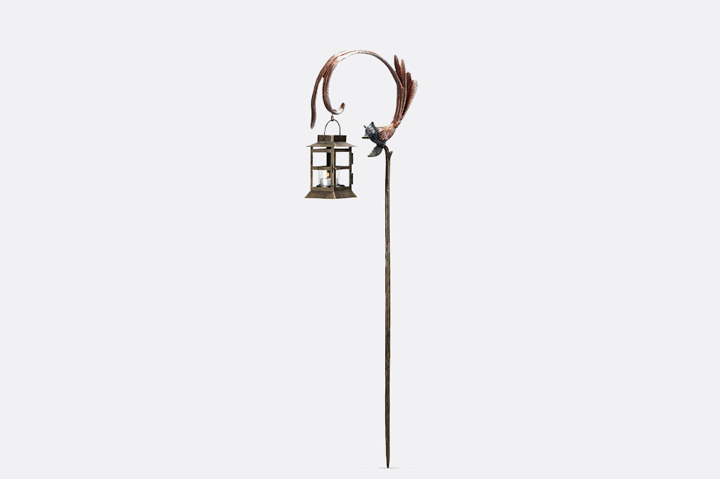 Flycatcher outdoor staked lantern with votive candle with bird facing left