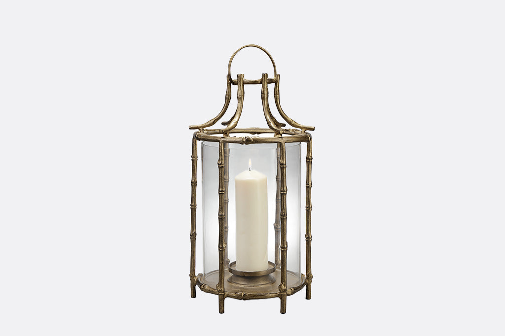 metal bamboo lantern on gray backdrop 