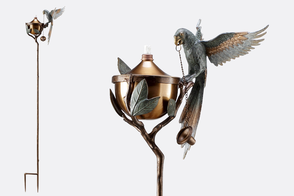Outdoor Garden Torch with parrot on a leafy branch. Close-up view of parrot and full-height product view shown.