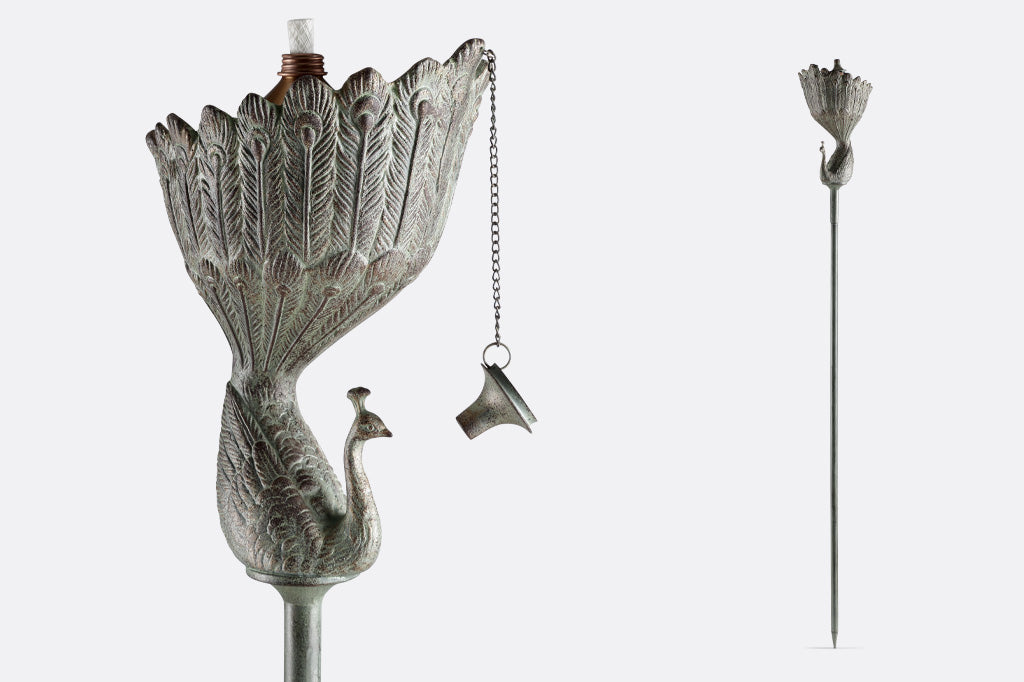 Peacock shaped garden oil torch in verdigris finish. closeup view and full height view of stake shown.