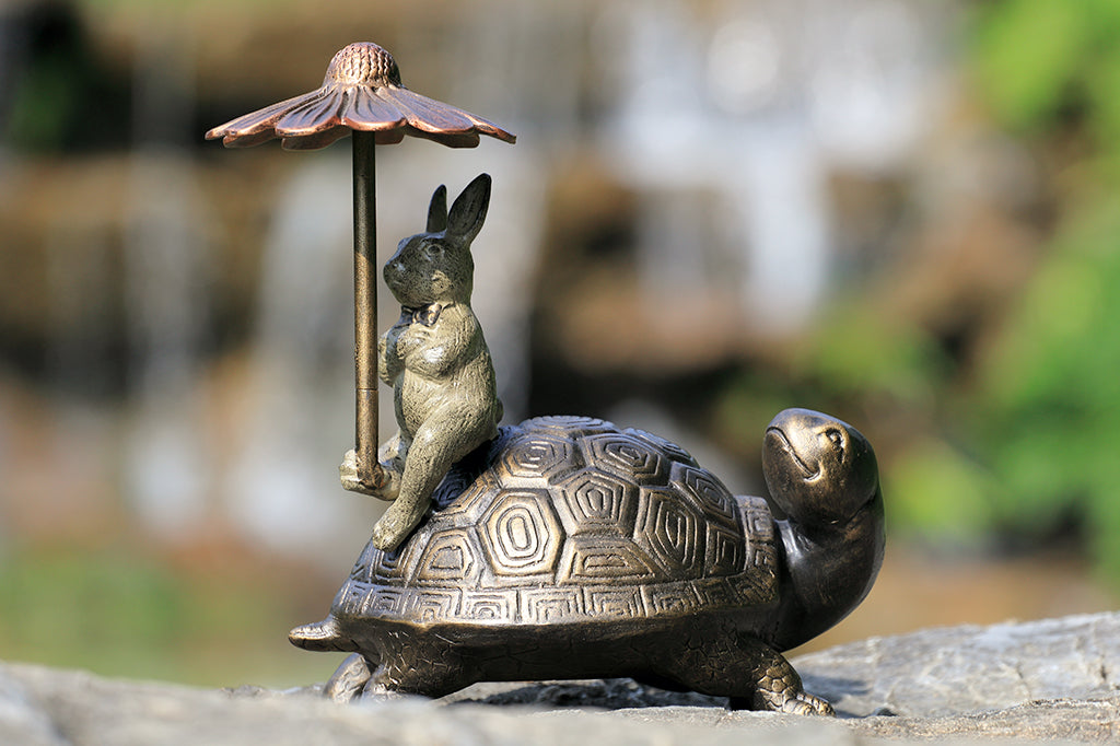 hidden keybox garden sculpture of rabbit and turtle