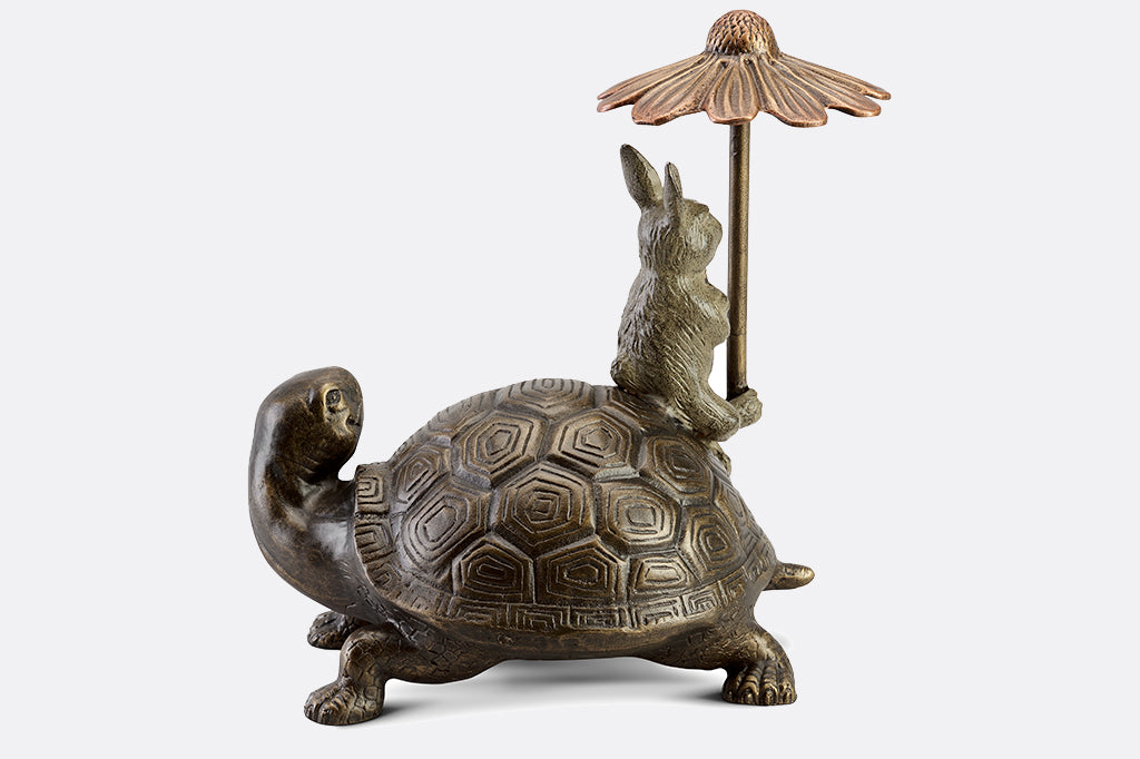 hidden keybox garden sculpture of rabbit and turtle