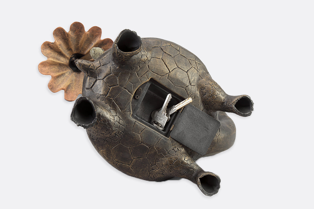 hidden keybox garden sculpture of rabbit and turtle - underside view with keys shown