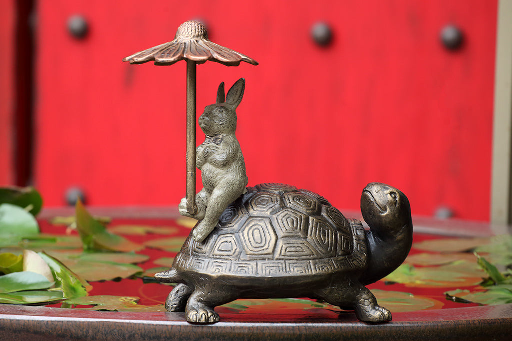 hidden keybox garden sculpture of rabbit and turtle