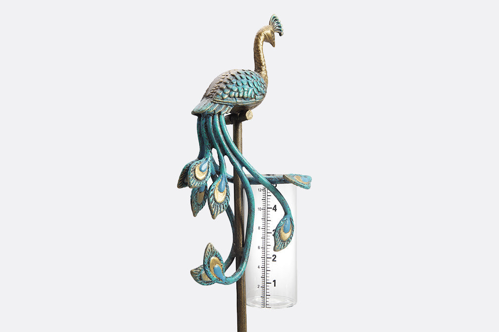 blue peacock rain catcher set in garden
