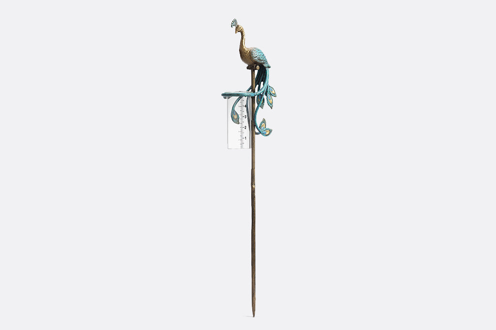 blue peacock rain catcher set in garden