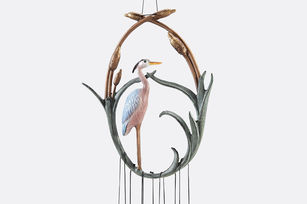 close up view of cast metal heron wind chime