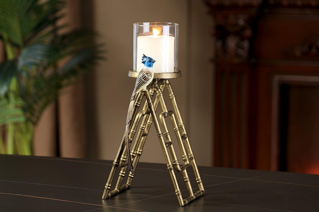Cast metal candleholder, bamboo detailing with flycatcher bird on side. Set on living room table