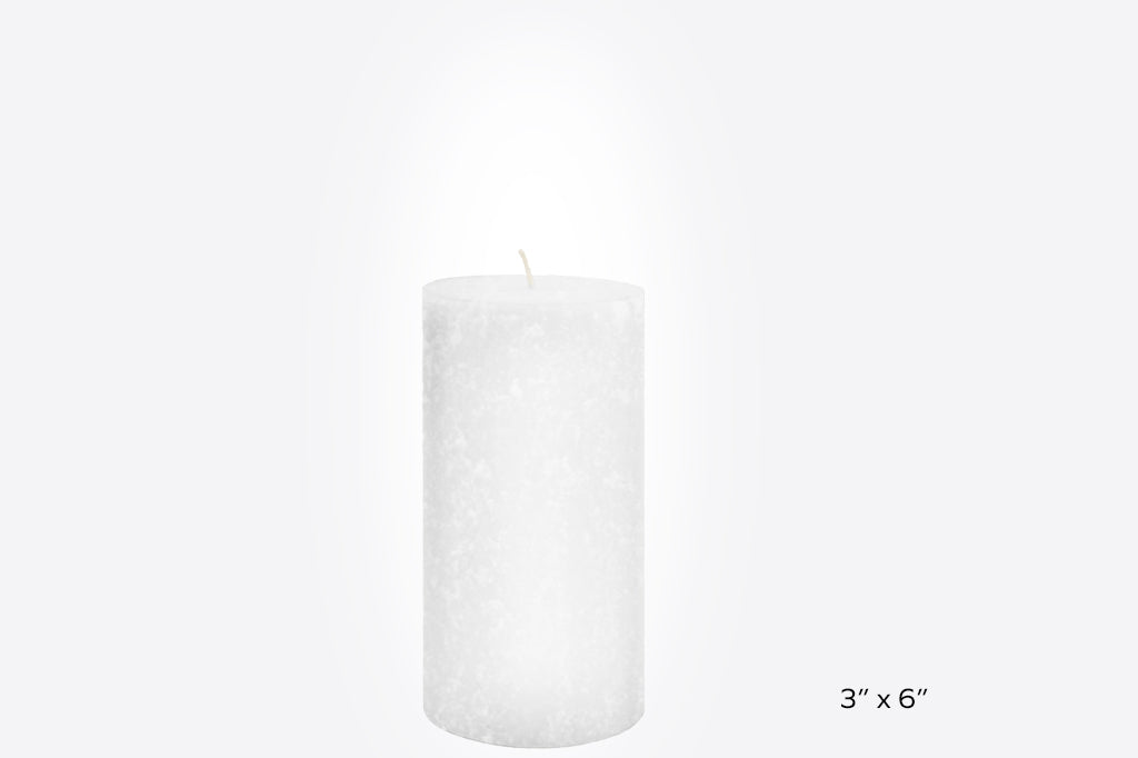 White pillar candle 3" by 6" inches