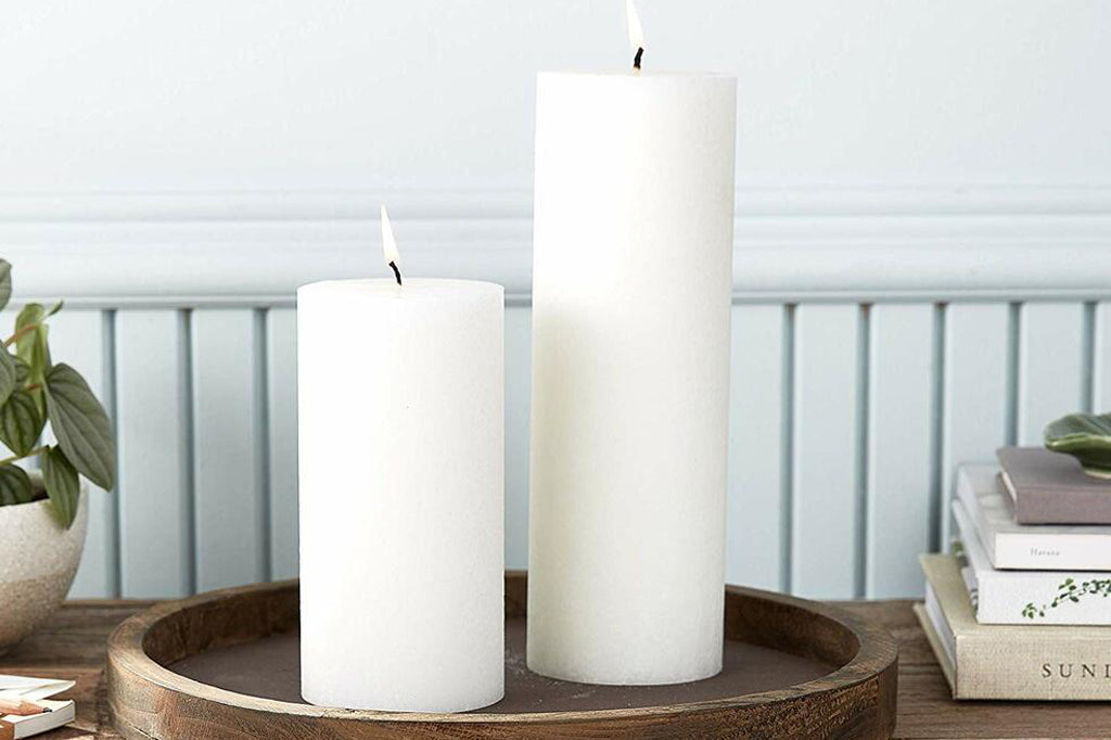 white pillar candle 3" by 9"inches