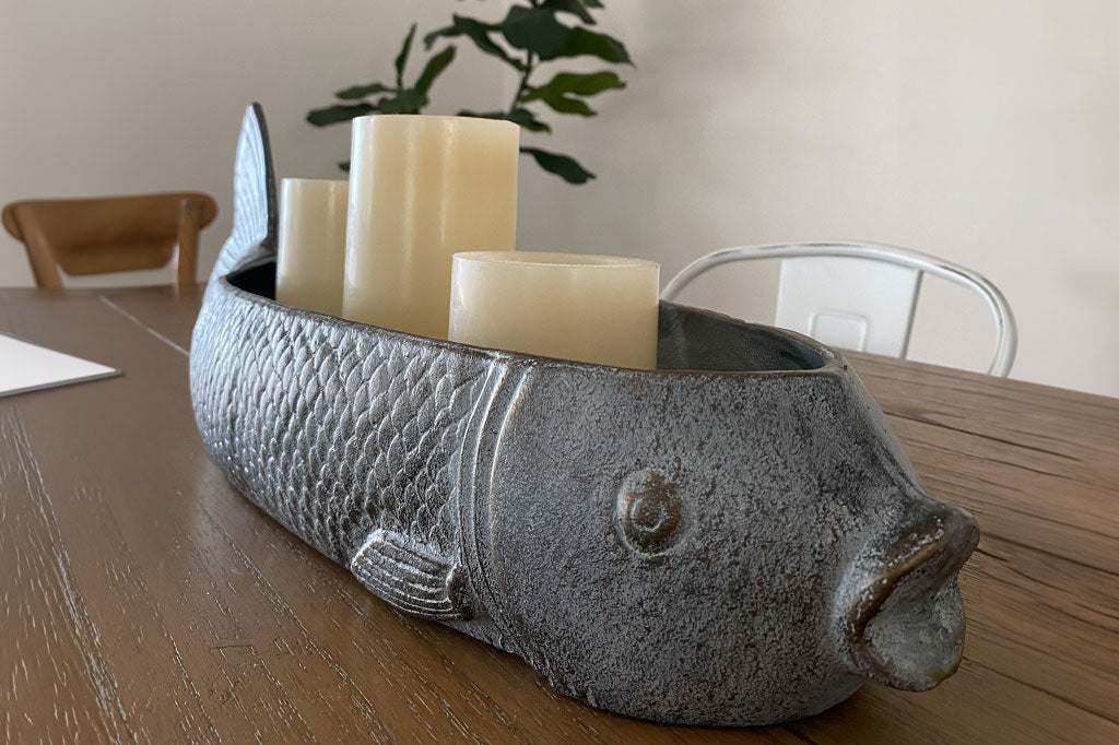 Fish Candleholder with 4 pillar candles shown on diningroom table