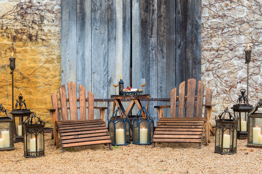 Pergamena Tall Oil Lantern Outside of winery amidst garden lanterns and outdoor patio seating