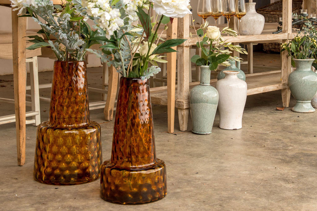 Enorme Ambra Vases shown with artificial flowers in a flowershop setting