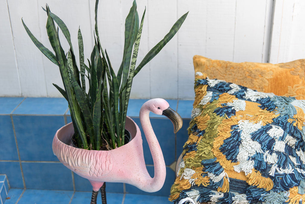 Festive Flamingo Planter & Beverage Tub shown in blue tile patio room