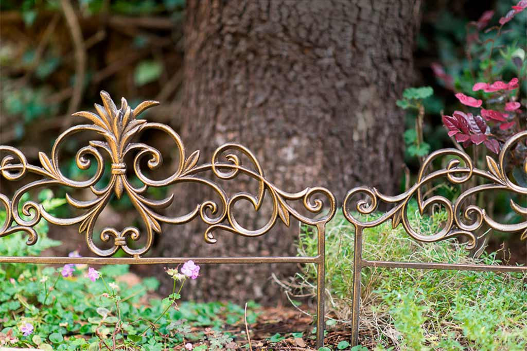 Scrollwork and sheaf of wheat design shown on the Alloro Garden Edging