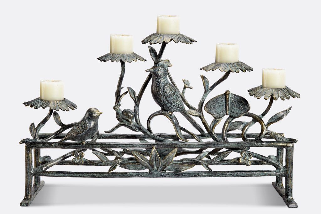 Jardin Fireplace Candelabra Silhouette shown with 5 votive candles, reveals vibrant finish of green patina over bronze
